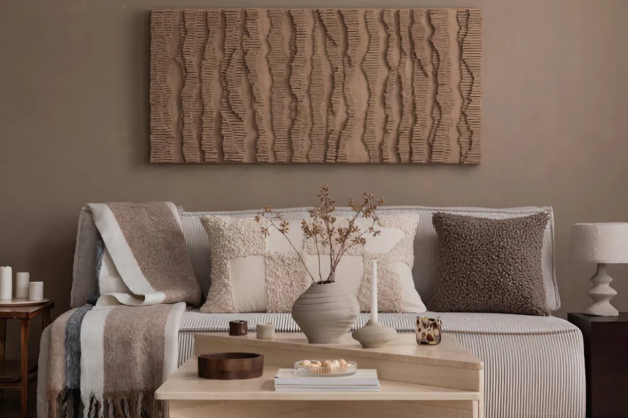 Cozy fall-inspired living room painted in warm neutral tones by an interior painter in Webster, TX